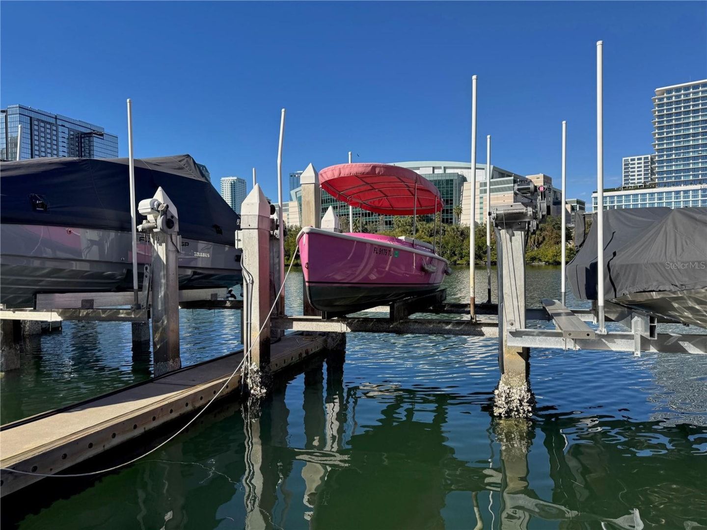 Boat slip #15 at Crimson Harbour Marina Tampa FL with Amalie Arena in background